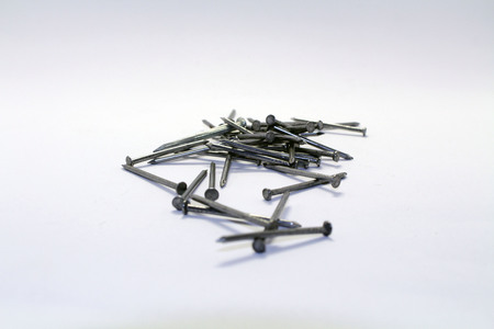A pile of nails, a pin shaped object of metal used as fastener. Trivial but essential.の写真素材