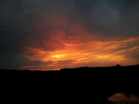 Clowdy sunset after rainの写真素材