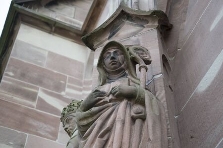 Detail shot of a figure on the Strasbourg cathedralの写真素材
