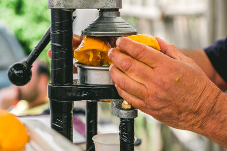 Squeezing Orange Juice Freshly Handsの写真素材