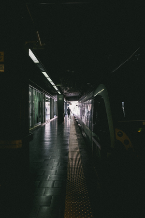 Moody Tunnel Train with Shadow of a Manのeditorial素材
