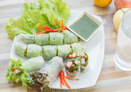 Fresh vegetable noodle spring roll with spicy sauce , diet food