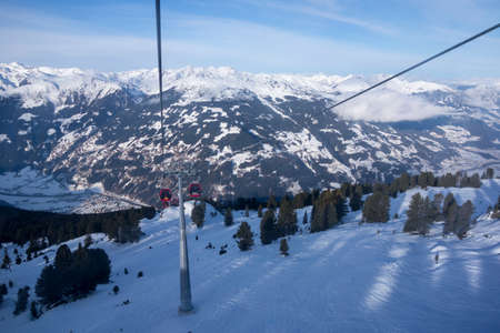 Winter landscape at ski area with a cabin ski lift at Zell am Ziller, Zillertal Arena, Austriaのeditorial素材