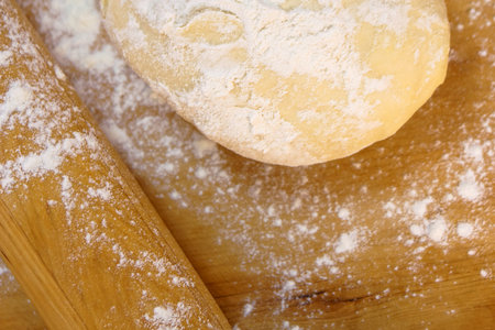 flour sprinkled on the dough and board