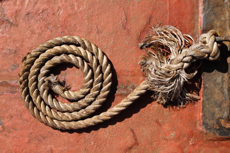 stranded rope on the deck of an old railroadの写真素材