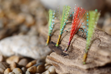 hooks with colorful feathers for fishing baitの写真素材