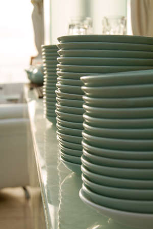 a stack of plates on the front of the restaurantの写真素材