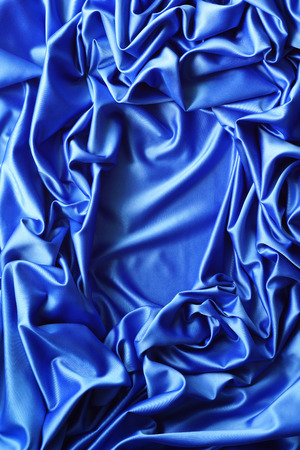 Satin fabric blue. Set of draperies with free space in the middle. Abstract backgroundの写真素材