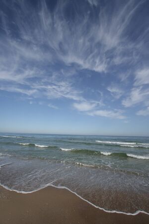calmed sea in an empty beachの写真素材