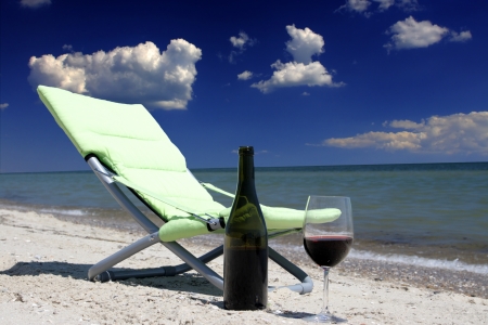Wine glasses standing on seacoastの写真素材