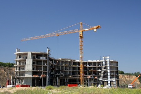 The elevating crane on building of a concrete construction の写真素材