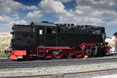 Old steam locomotive rising on mountain Brocken in Germanyの写真素材