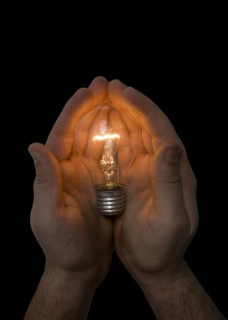 Light bulb in handの写真素材