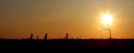 Smoking pipe against sunsetの写真素材