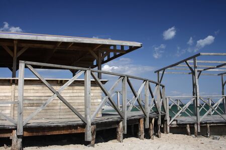 Wooden pier against the blue skyの写真素材