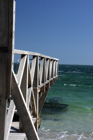 Wooden pier against the blue skyの写真素材