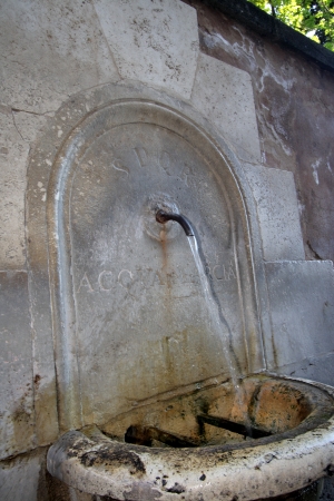 Drinking fountain with pure water on ruins of the Roman forumの写真素材