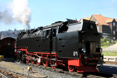 Old steam locomotive rising on mountain Brocken in Germany