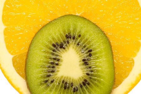 Slice of an orange and kiwi close up の写真素材