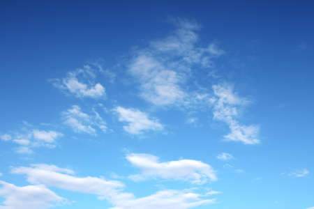 Clouds bathing in solar beams in the blue skyの写真素材