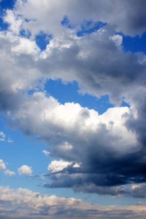 Clouds bathing in solar beams in the blue skyの写真素材