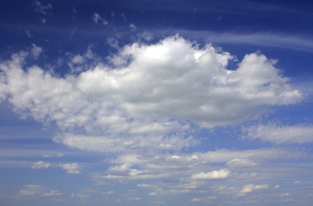 Clouds bathing in solar beams in the blue skyの写真素材