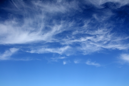Clouds bathing in solar beams in the blue skyの写真素材