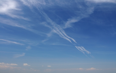 Clouds bathing in solar beams in the blue skyの写真素材