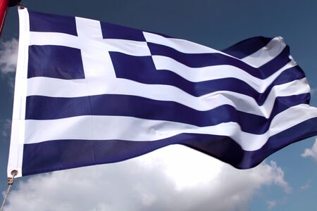 Greece flag on blue skyの写真素材