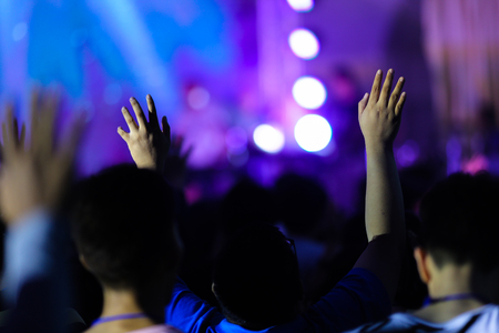 christian music concert with raised handの写真素材