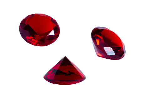 Ruby isolated on white background. Red stone close-up view from different sides.