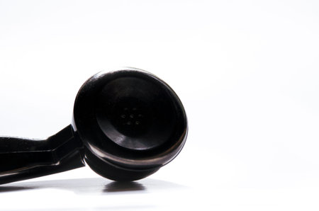 Telephone receiver isolated on white background. Shallow depth of field.