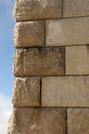 Background of stone wall with blue sky in background. Close-up.の写真素材