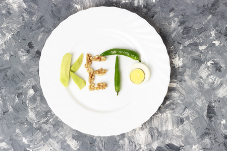 Inscription Keto made of nuts, eggs and avocado. Ketogenic diet conceptの写真素材