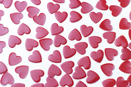 Red a hearts confetti on white background, a romance conceptの写真素材