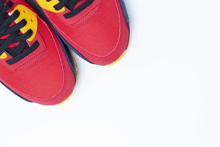 Red sneakers close up on a white background, top viewの写真素材
