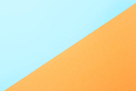 Abstract background of blue and orange color, top view, close-up, contrasting color
