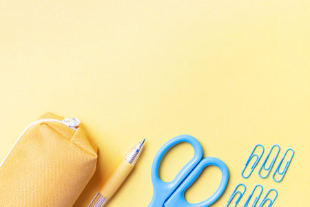 Stationery on a yellow background, a concept back to school