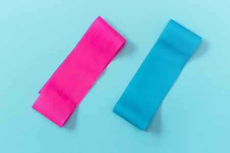 Elastic expanders on a blue background view from above, copy spaceの写真素材