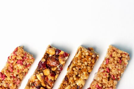 A few bars with cereals and useful trace elements on a white backgroundの写真素材
