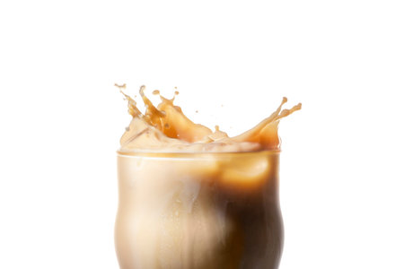 Glass of coffee with milk, splash on a blue background, a copy of the space