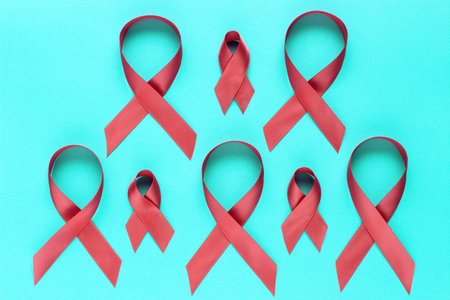 Many pink ribbons on a blue background, concept breast cancer awareness month