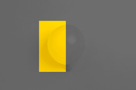 Balloon on trendy yellow and gray background, concept color of year 2021.の写真素材