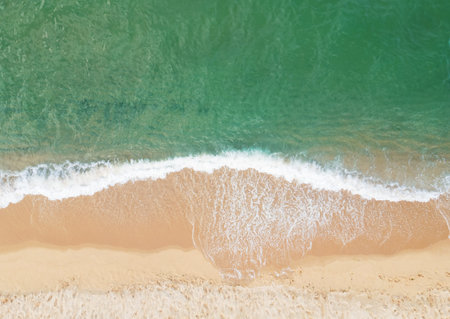 A sea waves and beach top view, a natural background.の写真素材