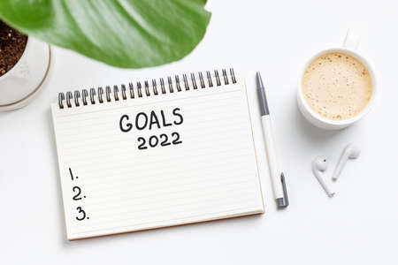 Inscription goal 2022 in paper notebook close-up, top view with copy space.の写真素材
