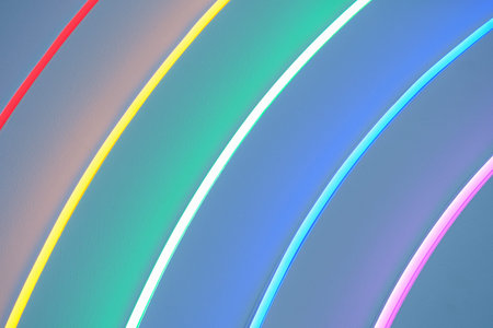 Bright neon rainbow from thin multicolored stripes, abstract background close upの写真素材