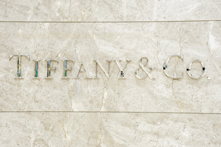 Seoul - 12.06.2021: Tiffany Co inscription on marble wall close-up.のeditorial素材