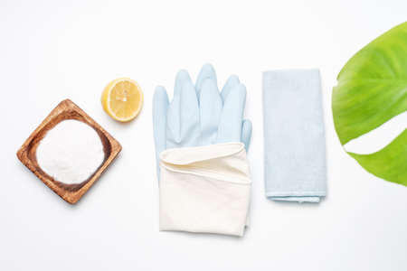 Soda, lemon and gloves on white background close-up, spring cleaning concept.の写真素材