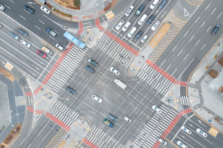 The movement of cars at crossroads in city, aerial view.