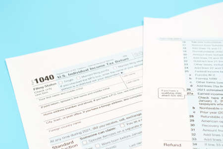 Individual tax form on blue background top view, close-up.の写真素材